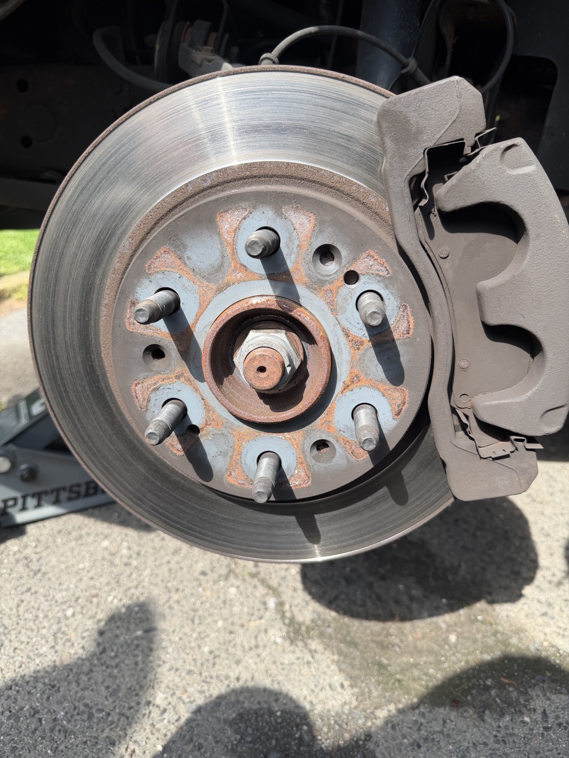 Worn brake rotor before replacement